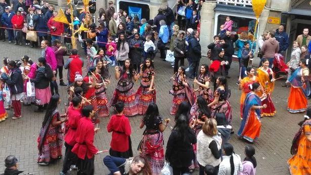 Performers at the 2015 Chester Diwali Festival prepare for the dancing displays to get under way in Eastgate Street